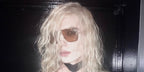 Celebrity rapper 2hollis was seen wearing gold Tom Ford Stavros TF1204 30E aviator sunglasses with yellow lenses in his Instagram post, December 2025.