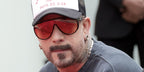 Celebrity and singer AJ McLean of Backstreet Boys was seen wearing black Tom Ford Achilles TF1182 05E sunglasses with persimmon Photochromic lenses at the hand and footprint ceremony for Jo Koy in Hollywood, February 2026.