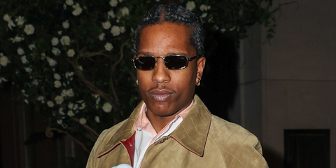 ASAP Rocky was seen wearing gold Ray-Ban x ASAP Rocky Metal RB 3927 001/31 rectangular sunglasses with green lenses in New York City, May 2026.