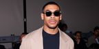 Aaron Pierre was seen wearing transparent grey Giorgio Armani AR8210U 6080/56 square sunglasses to attend the Giorgio Armani Spring/Summer 2025 fashion show during Milan Men's Fashion Week