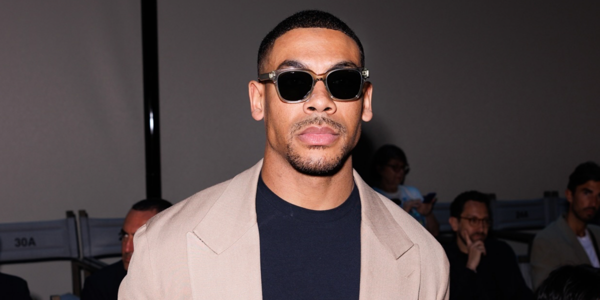Aaron Pierre was seen wearing transparent grey Giorgio Armani AR8210U 6080/56 square sunglasses to attend the Giorgio Armani Spring/Summer 2025 fashion show during Milan Men's Fashion Week