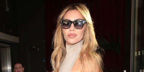 Model Abbey Clancy was seen wearing black Saint Laurent SL M106 002 sunglasses with grey gradient lenses at the special screening of "Strictly Confidential" in London, May 2024