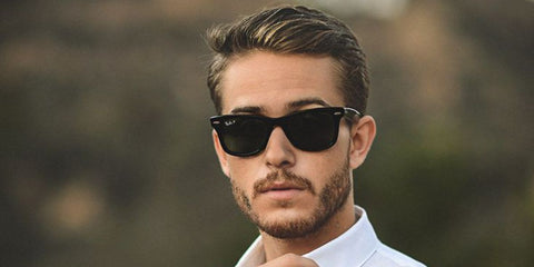 Menswear content creator Adam Gallagher was seen wearing the iconic Ray-Ban Wayfarer 2140 901/58 Polarised sunglasses in a social media post. Shop online now on Pretavoir