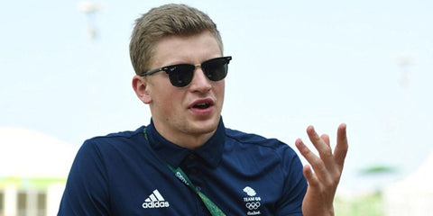 British Olympic swimmer Adam Peaty was seen wearing black Ray-Ban Clubmaster RB 3016 901/58 half-rim sunglasses with Polarised lenses in an interview with Daily Mail