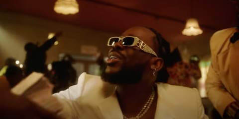 Nigerian singer-songwriter Adekunle Gold was seen wearing crystal studded Balenciaga BB0096S 013 sunglasses in his music video Ogaranya. Shop online now on Pretavoir