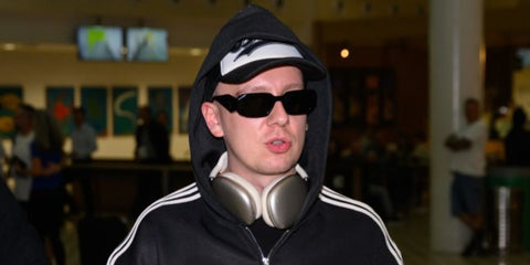 Rapper AItch was seen wearing black Prada PR 17WS 1AB5S0 Symbole Sunglasses.