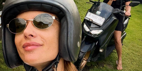 Celebrity and supermodel Alessandra Ambrosio was seen wearing gold Saint Laurent Sun SL 692 003 oval sunglasses in Bali, Indonesia, April 2026.