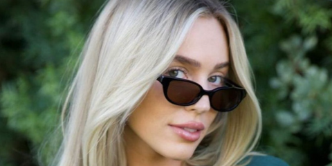 American podcaster Alex Cooper wears DMY Studios Romi sunglasses in black