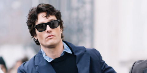 Spanish model and actor Alex Sanchez de Mora was seen wearing black Prada PR B12S 16K731 sunglasses at the Prada Menswear Fall/Winter 2025 fashion show during Milan Men's Fashion Week.