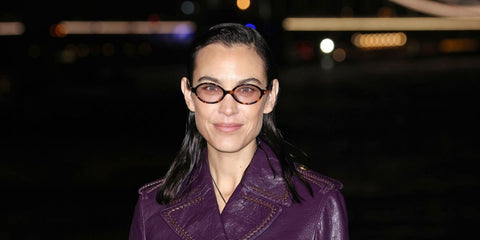 Alexa Chung was seen wearing tortoiseshell Miu Miu MU 04ZS 14L4I0 oval sunglasses with light pink lenses at the Burberry Fall/Winter 2026 fashion show during London Fashion Week.