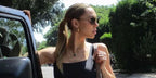 Alexis Ren was seen wearing gold Saint Laurent SL 312 M 014 sunglasses with brown lenses