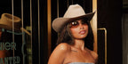 Television personality Amber Gill of Love Island was seen wearing Miu Miu MU A51S 5AK20P rimless sunglasses with brown gradient lenses at Beyonce's Cowboy Carter concert in London, June 2025.
