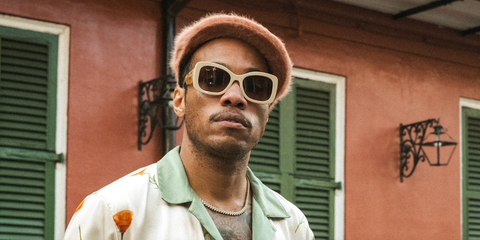 Anderson .Paak was seen wearing beige white Prada PR A08S 11O6S1 sunglasses in a promotional image for the New Orleans Jazz & Heritage Festival 2024