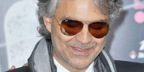 Andrea Bocelli was seen wearing Ray-Ban Aviator 3025 001/33 sunglasses with gold frame and brown lenses