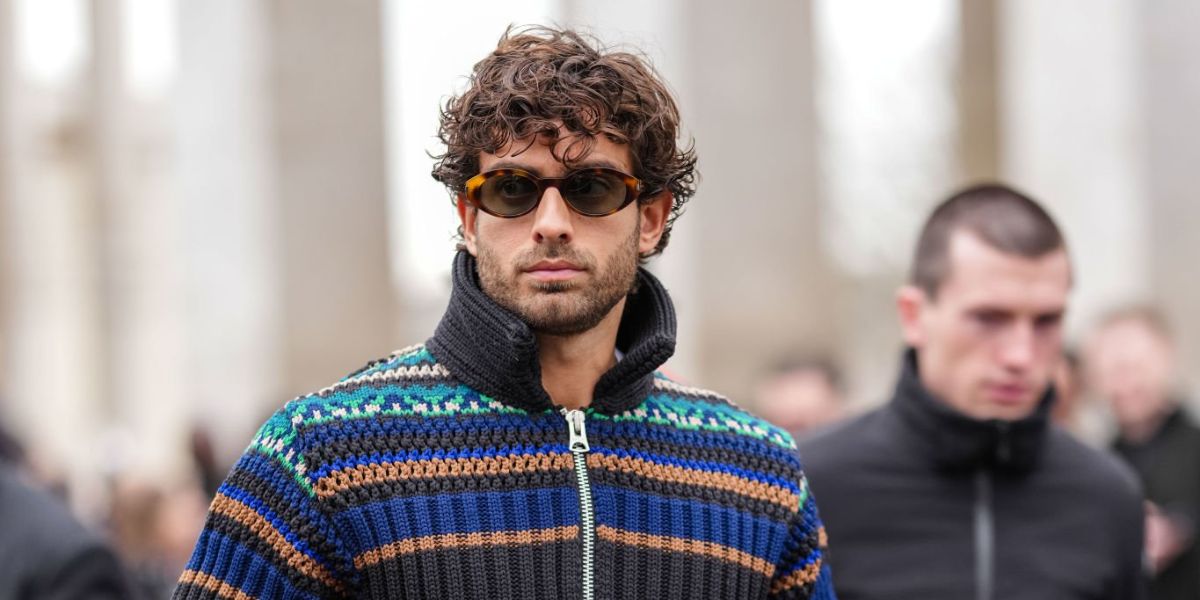 Canadian-Greek model Andrew Georgiades was seen wearing tortoiseshell Saint Laurent SL 567 002 oval sunglasses to attend the Sacai Menswear Fall/Winter 2025 fashion show during Paris Fashion Week