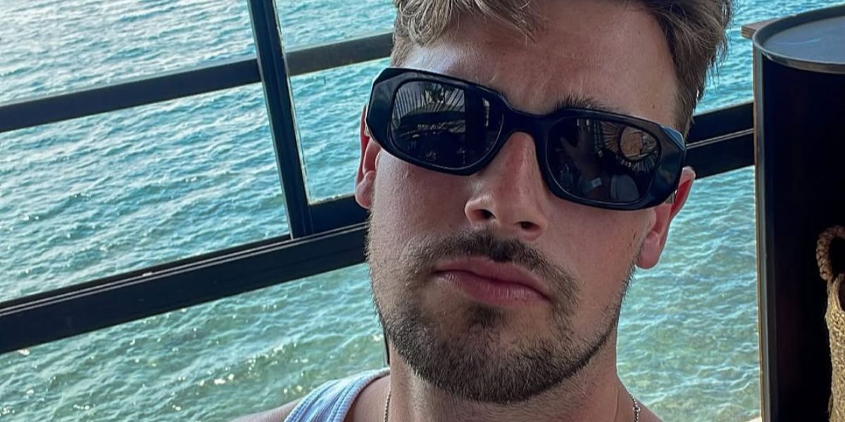 Television personality Andrew Le Page was seen wearing black Prada PR 17WS 1AB5S0 Symbole Sunglasses in his Instagram post, June 2025.