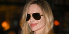 Angelina Jolie was seen wearing gold Bottega Veneta BV1305S 007 Sardine aviator sunglasses with brown lenses at the special screening of her new film "Couture" in New York City, June 2026.