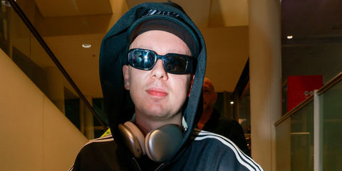 YouTuber Morgan Burtwistle, widely known as AngryGinge, was seen wearing black Prada PR 17WS 1AB5S0 Symbole Sunglasses 