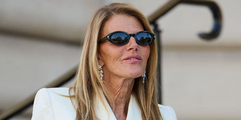 Anna Dello Russo was seen wearing black Saint Laurent Sun SL 567 001 sunglasses at the Schiaparelli Haute Couture Fall/Winter 2026 fashion show during Paris Couture Week.