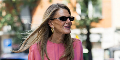 Anna dello Russo was seen wearing black Saint Laurent Sun SL 557 Shade 001 sunglasses to attend the Giorgio Armani Spring/Summer 2026 fashion show during Milan Men's Fashion Week
