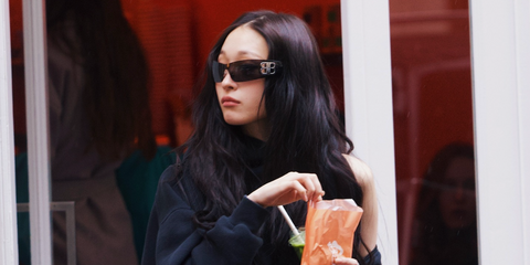 South Korean singer Annie Moon of AllDay Project was seen wearing Balenciaga BB0359S 001 wraparound sunglasses featuring double B logo in Balenciaga's Instagram story promoting the new Balenciaga City Bag in November 2025.