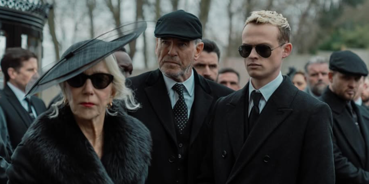 Anson Boon, pictured with Helen Mirren and Pierce Brosnan, was seen wearing black Ray-Ban Aviator 3025 002/58 Polarised sunglasses in 2025 Paramount+ series MobLand, as Eddie Harrigan