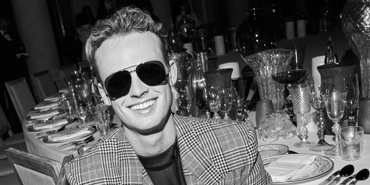 Anson Boon was seen wearing silver Saint Laurent Sun SL 653 Leon 001 aviator sunglasses