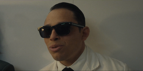 Celebrity actor and singer Anthony Ramos was seen wearing black Prada PR A17S 16K731 square sunglasses in 2026 series FX The Beauty as The Assassin
