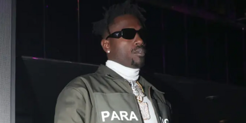 Antonio Brown was seen wearing Prada PR 17WS 1AB5S0 Symbole Sunglasses during his album release party in New York