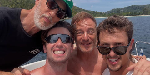 Arnas Fedaravicius, pictured far right, was seen wearing black Ray-Ban Mr Burbank RB 2283 901/31 sunglasses in Thailand with The White Lotus season 3 co-stars Jon Gries, Patrick Schwarzenegger, and Jason Isaacs