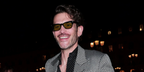 French actor Arnaud Valois was seen wearing black Tom Ford Penn-02 TF1362/S 01N sunglasses with light green lenses at the Tom Ford Fall/Winter 2026 fashion show during Paris Fashion Week.
