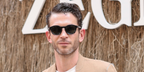 French actor Arnaud Valois was seen wearing Zegna Havana Aurora I EZ0229 05N sunglasses at the Zegna Spring/Summer 2025 fashion show during Milan Men's Fashion Week