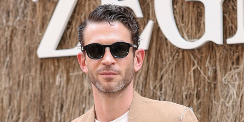 French actor Arnaud Valois was seen wearing Zegna Havana Aurora I EZ0229 05N sunglasses at the Zegna Spring/Summer 2025 fashion show during Milan Men's Fashion Week