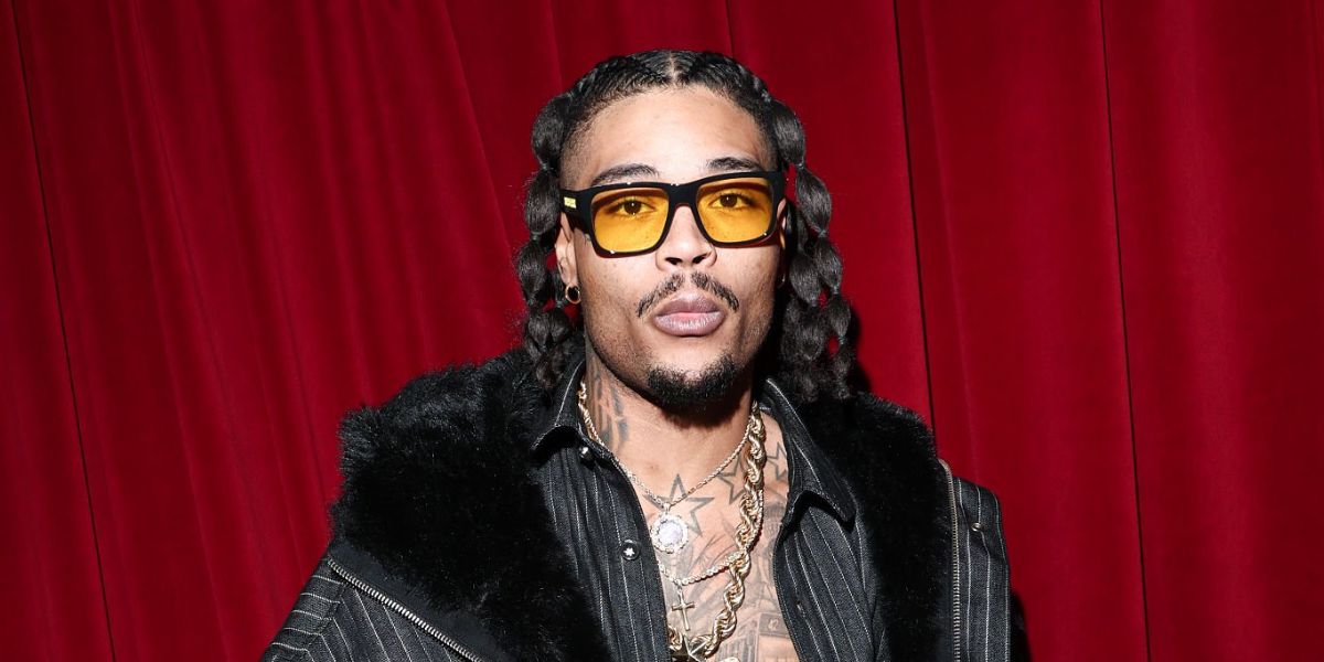 Italian rapper Artie 5ive was seen wearing black Burberry Knight BE4358 300185 sunglasses with yellow lenses at the PDF Menswear Fall/Winter 2026 fashion show during Milan Men's Fashion Week.