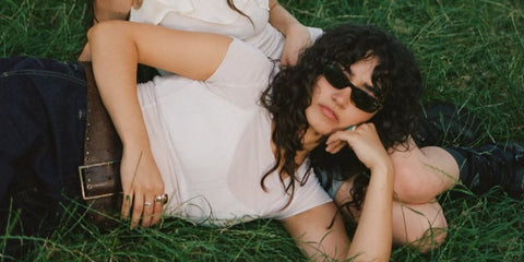 Asha Banks was seen wearing tortoiseshell Miu Miu MU A06S 14L09Z sunglasses in the promotional image of her collaboration with Holly Humberstone, "Dive".