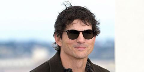 Ashton Kutcher was seen wearing Oliver Peoples Forman L.A OV5414SU 1722/83 Polarised sunglasses at the Rome premiere of thriller series "The Beauty", January 2026.