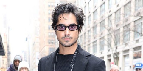 Actor Avan Jogia was seen wearing black Prada PR B06S 16K40J sunglasses with purple lenses in New York City, February 2026.