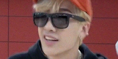 Australian singer Bang Chan of K-Pop group Stray Kids was seen wearing rubber black Ray-Ban Justin 4165 601/8G sunglasses with grey gradient lenses in 2021. Shop online now on Pretavoir