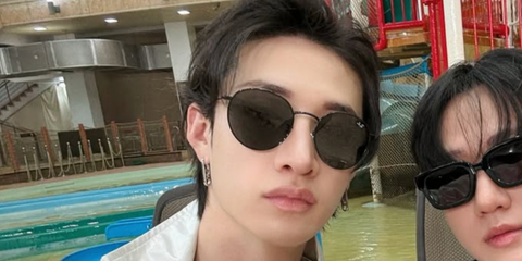 Australian-Korean singer Bang Chan of the K-Pop group Stray Kids was seen wearing black Ray-Ban Round Metal RB 3447 9199/31 sunglasses in his fellow Stray Kids member Changbin's Instagram post, July 2025.