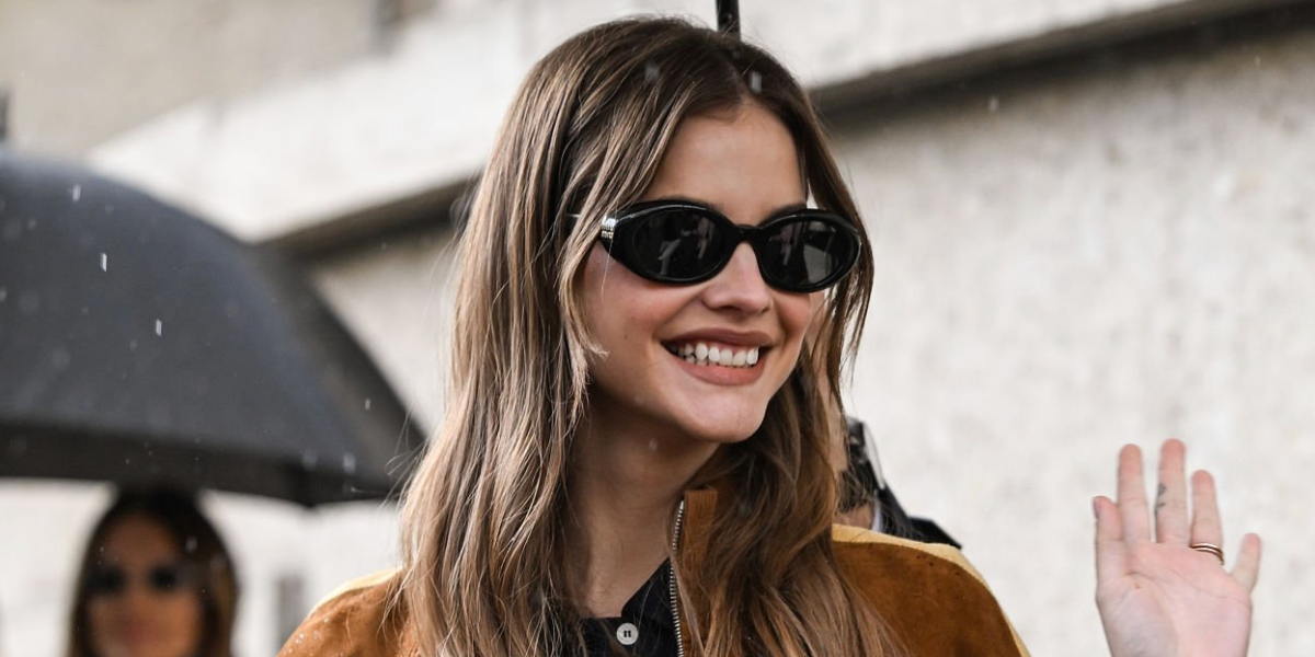 Celebrity model Barbara Palvin was seen wearing new Miu Miu MU B09S 16K08Z round sunglasses in black at the Miu Miu Fall/Winter 2026 show during Paris Fashion Week.