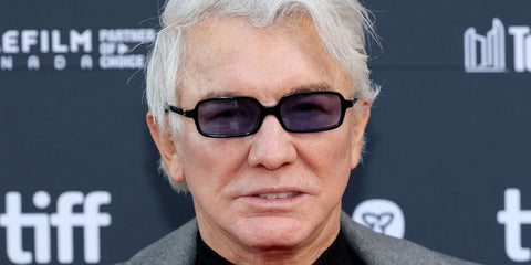 Australian filmmaker and producer Baz Luhrmann was seen wearing black Miu Miu MU 11ZS 16K01O Regard rectangular sunglasses with purple lenses at the Toronto International Film Festival 2025. Shop online now on Pretavoir