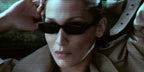 Bella Hadid was seen wearing black Saint Laurent Sun SL 872 Erin 001 sunglasses in the Saint Laurent Spring/Summer 2026 campaign.