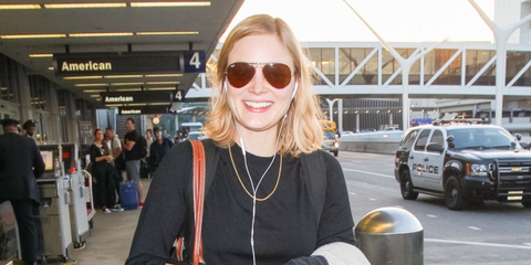 Australian actress Bella Heathcote was seen wearing Ray-Ban Aviator 3025 001/33 sunglasses with brown lenses at LAX, April 2018.