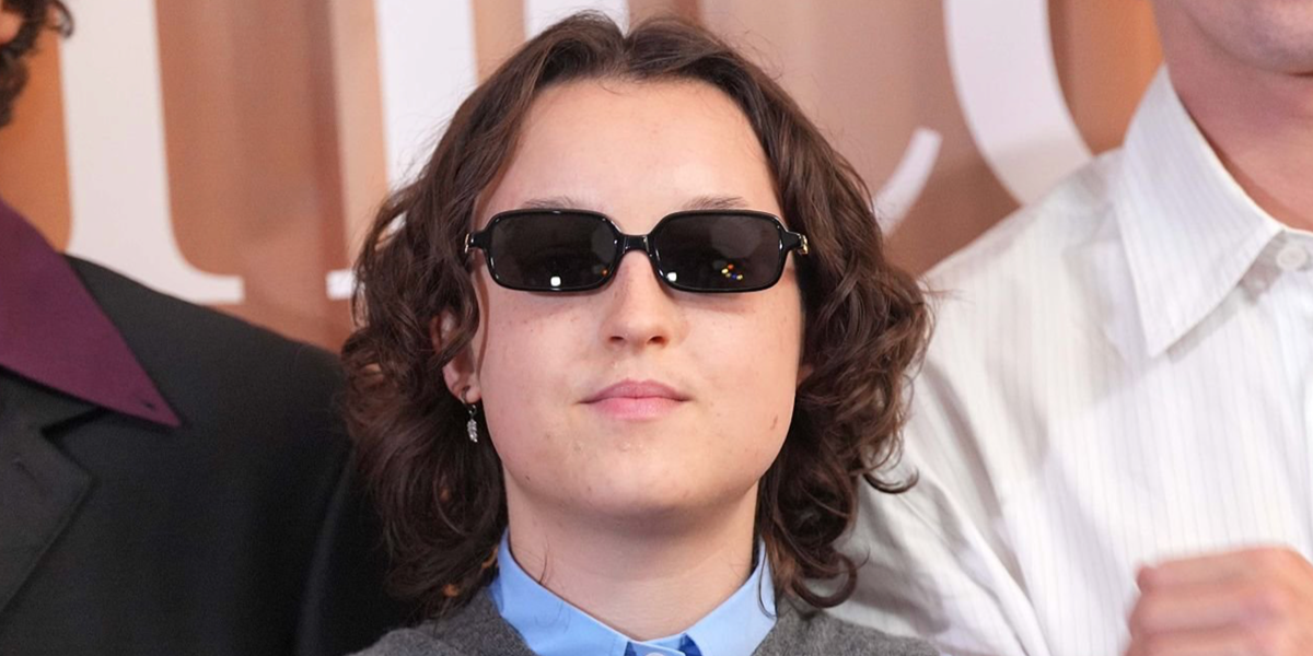 Bella Ramsey was seen wearing black Miu Miu Regard MU 11ZS 16K5S0 rectangular sunglasses at the London premiere of "Sunny Dancer", August 2026.