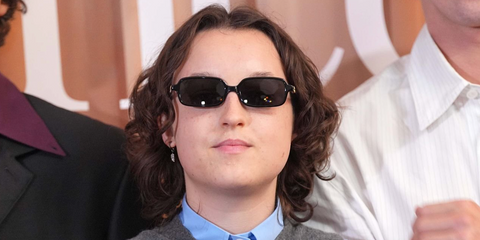 Bella Ramsey was seen wearing black Miu Miu Regard MU 11ZS 16K5S0 rectangular sunglasses at the London premiere of "Sunny Dancer", August 2026.