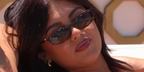 Television personality Belle Hassan was seen wearing tortoiseshell Miu Miu MU A06S 14L09Z in Love Island All Stars 2026.