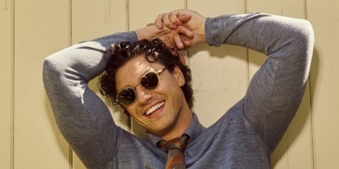 Off Campus actor Belmont Cameli was seen wearing beige Giorgio Armani AR6181 6300/73 sunglasses with brown lenses in a Bustle feature, May 2026.