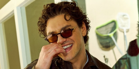 Off Campus actor Belmont Cameli was seen wearing dark tortoiseshell Giorgio Armani AR8227T 6207/73 sunglasses in a Bustle feature, May 2026.