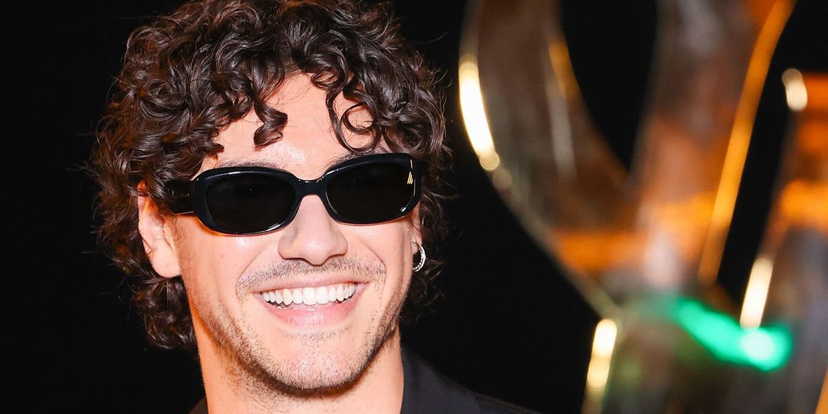 Off Campu star Belmont Cameli wore black Saint Laurent Sun SL 868 001 sunglasses at the Saint Laurent Spring Summer 2027 show during Paris Fashion Week.