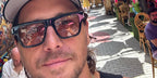 Actor Ben Robson was seen wearing black Saint Laurent Sun SL 469 001 sunglasses while traveling in Europe, shared through his Facebook post in AUgust 2024.